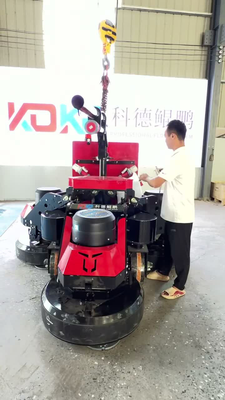 Worker assembling a KDKP floor grinding machine in the workshop
